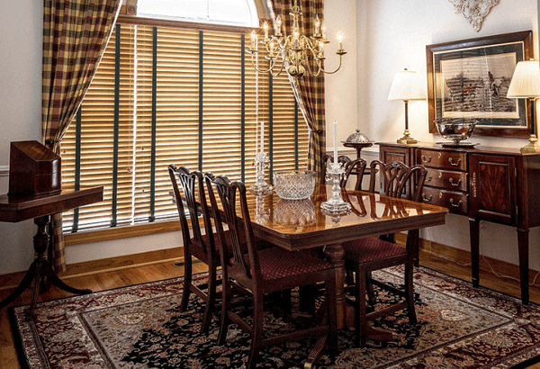 Bamboo window blinds in a classic interior design setting. These window blinds can be installed on both windows and glazed doors as is seen in this picture..