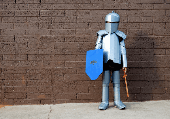 This fantastic costume is made with cardboard, altered clothes, paper mache and duct tape ...and the wooden swords are bought :)