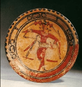 Three hieroglyphic designs circle the central dancing figure on this plate. The dancing Maize God is depicted in a dynamic position. He wears a waist belt known form ball games.
