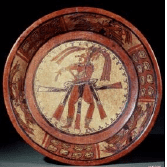 The dancing Maize God again. A panel depicting a small version of the dancing God is repeated three times.