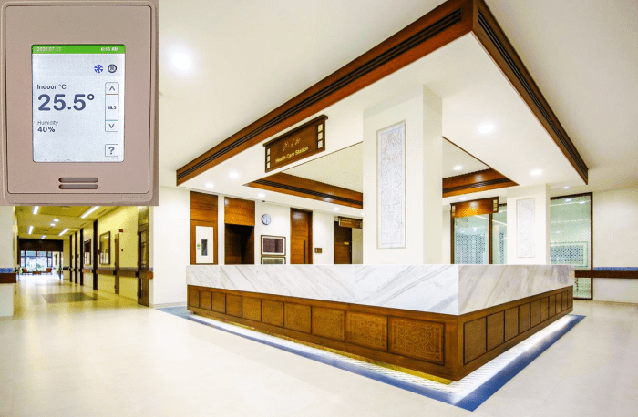 Thermostat's location relative to air supply and return outlets is critical to maintaining temperatures within the specified range in indoor spaces. Inset shows a digital temperature controller used in this building.