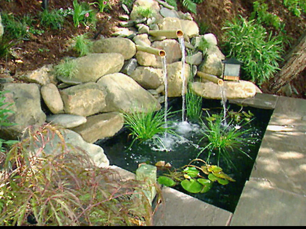 Natural setting - Patio water feature with a fountain emptying into a small pond