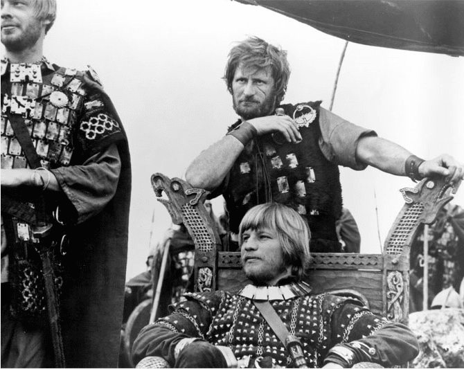 Michael York as Guthrum. He assumed kingship of East Anglia after Eadmund's death for cowardice by the Danes at Bury in Suffolk. Eadmund fled to the church, leaving his men to fight for him (still from the film 'Alfred the Great' with David Hemmings