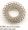 Picture 1 of 2: A finger ring made of micromail (really tiny rings) in European 4-in-1 weave