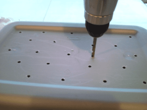 Try to get your holes spaced about 2 to 21/2 inches from one another on all surfaces of the tote and lid that you are drilling.
