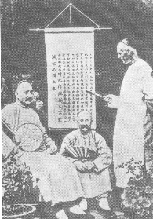 Western Missionaries in China, circa 1900. Note that these missionaries have adopted Chinese dress and appear to be studying Chinese characters.