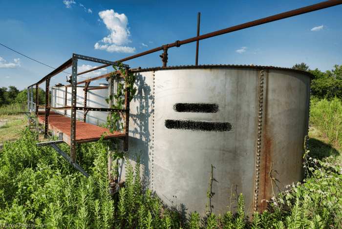 Abandoned oil well tanks such as this one pose a danger to children and wildlife, which may fall in and become trapped.