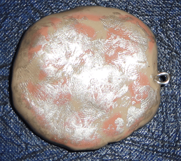 If you paint over the project with acrylic paint once it's cooled, brush on the Varathane when dried. It not only protects the piece, but as with this pendant here, the metallic paints that are just dabbed on show their effects.