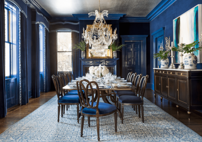 The Ox dining room has shades of blue, a long table for many guests, and a rug to bring everything together. The Ox prefers a practical dining area with conservative tastes.