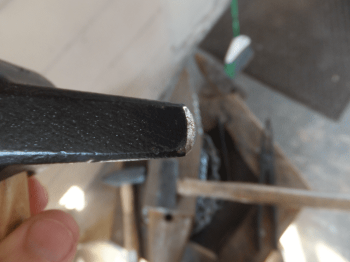 When striking with a cross pein, material is moved above and below the pein, but not much side to side.