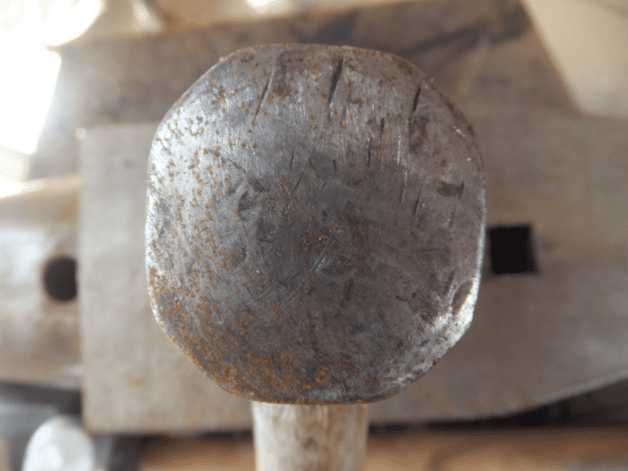 Damage at the 12 o'clock and 2 o'clock position of blacksmith hammer. This hammer should be redressed.