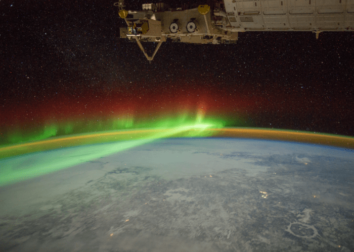 The aurora borealis in this picture from February 2012. This image also shows airglow along the horizon. The Manicouagan Crater, seen in the lower right, was created by an asteroid impact approximately 214 million years ago