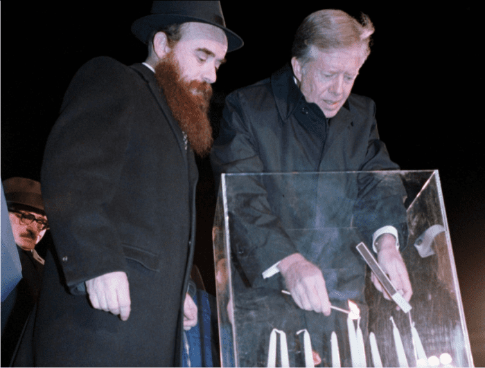President Jimmy Carter lights a menorah in Lafayette Square across from the White House on Dec. 17, 1979. (Karl H. Schumacher, White House photograph/National Archives)