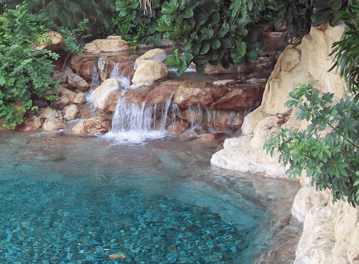 The photo below is the freshwater beach. The lazy river flows though that ghat cave behind the waterfall.