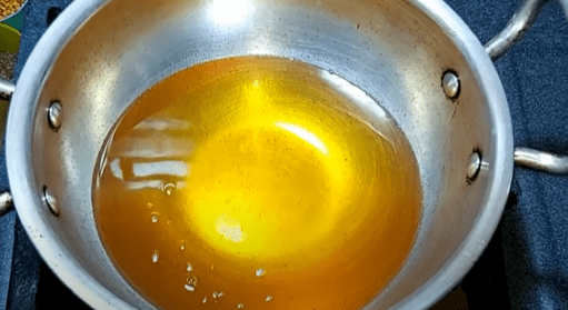 Heat oil in a wok for deep-frying. Check the temperature of the oil by dropping a small portion of the dough.