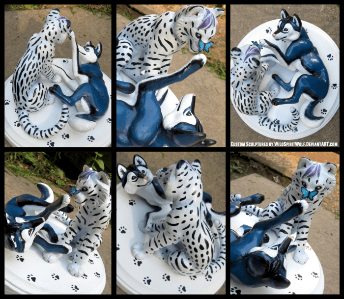 This white tiger and blue canine are an odd match, but beautiful nonetheless. There is even a butterfly to add a hint of playfulness to the pair's interaction.