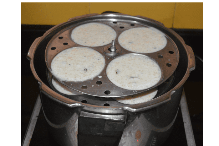 Place the stand inside the cooker. Cover it with the lid. Don't place the cooker weight. Steam-cook it for 20 minutes.