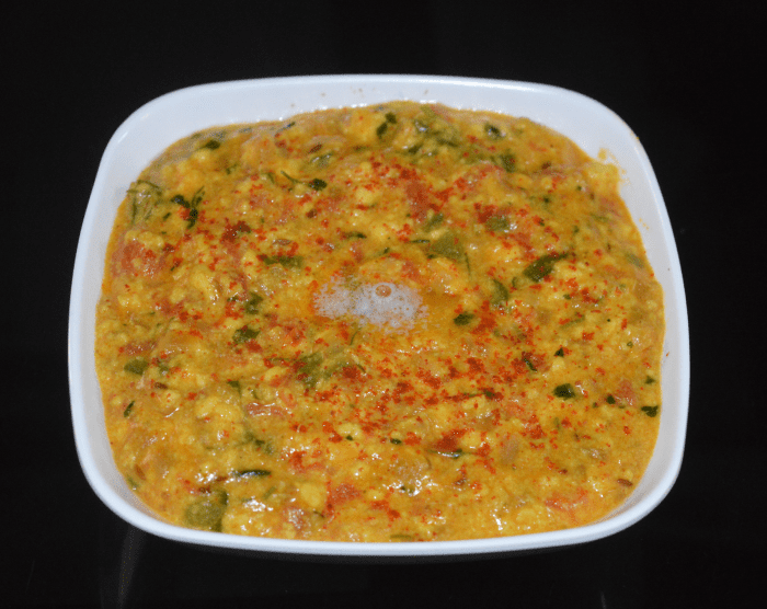 Transfer it to a serving dish. Garnish with a pinch of red chili powder and a teaspoon of butter. Serve with flatbread, chapati, poori, fried rice, or ghee rice.