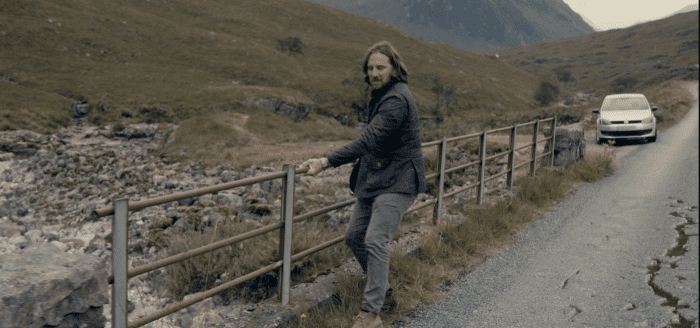 Peter (Howard J. Davey) grabs hold of the bridge railing to avoid the CGI crack. He also jumps over some cracks earlier in the film.
