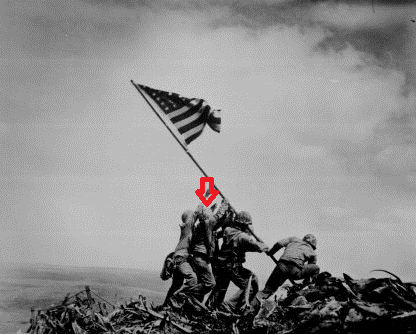 "Raising The Flag on Iwo Jima," by Joe Rosenthal. Pictured left to right are Ira Hayes, Harold Schultz, Michael Strank, Franklin Sousley, Rene Gagnon, and Harlon Block. The red arrow denotes Schultz.