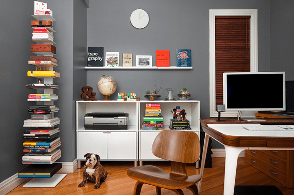 Utilizing a dead corner of a room with floating shelving—this is decorating a small space effectively.
