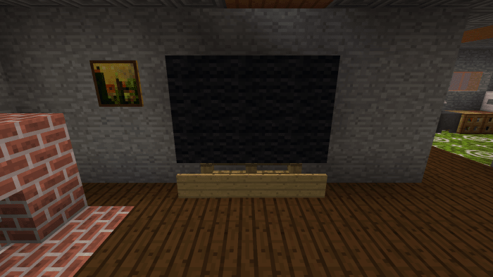 This TV was made with six black wool blocks, three fence posts and three signs.