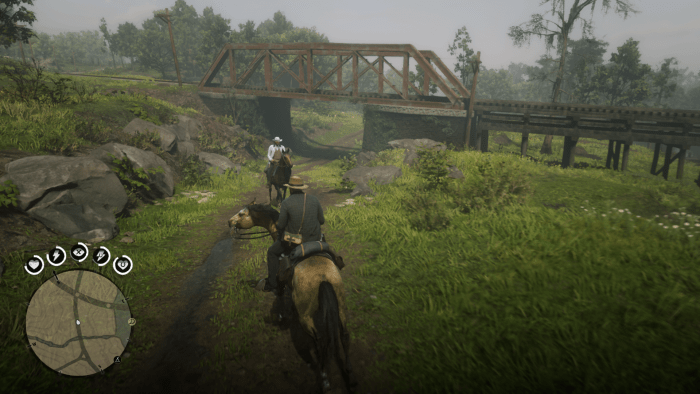 As you follow the road you'll have to climb up to the left to reach this train bridge. And no I didn't run into Colonel Sanders (literally) while taking this screenshot.