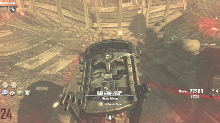 You can see the invisible zombie while you have an active Zombie Blood Power-Up. His red eyes give him away.