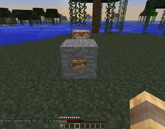 This command block gives the player who pushes the button a command block!