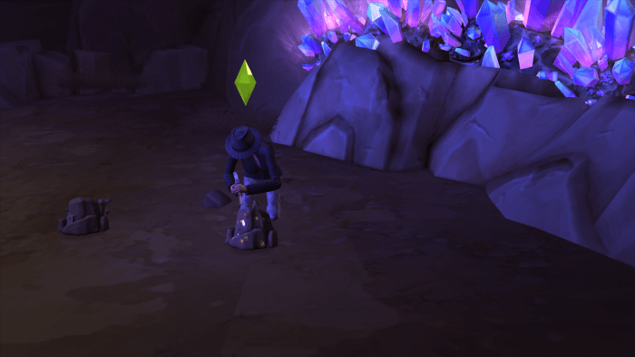 A sim chipping away at a rock in the Forgotten Grotto of "The Sims 4." You need Handiness to get in here.
