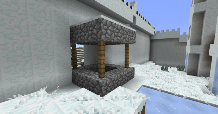 Village generation bugs, such as this well sitting in the town's only gate, are probably the mod's biggest issue.
