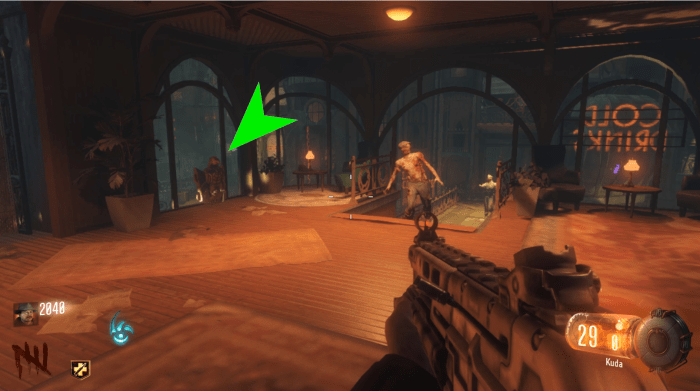 The statue is in the same room as perk, leaning against one of the windows. It can also be seen from the walkway outside.