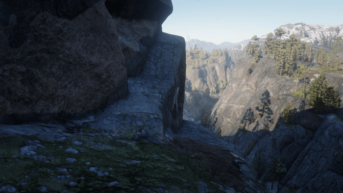 The fork in the path you come to. Lower slope, on the right, leads to a Rock Carving. The upper slope on the left is what you want to follow to get the treasure.
