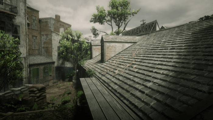 Crouch/take cover between these two windows when you kick off the gun battle. Keep in mind cops will come from three directions, but you'll be well protected here.