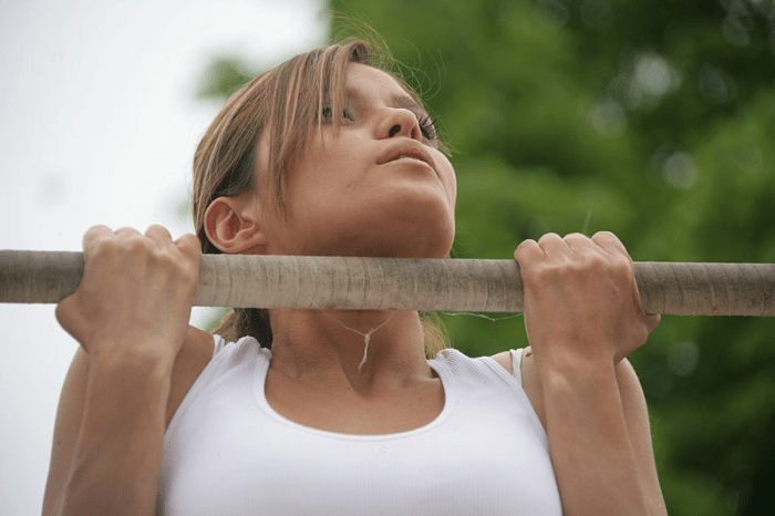 Strong woman doing pull up