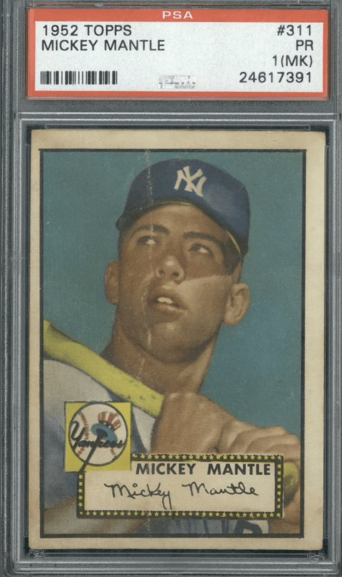 A graded 1952 Topps Mickey Mantle baseball card. In poor condition, the card would command thousands of dollars at auction because it is one of Mantle's rarest cards.