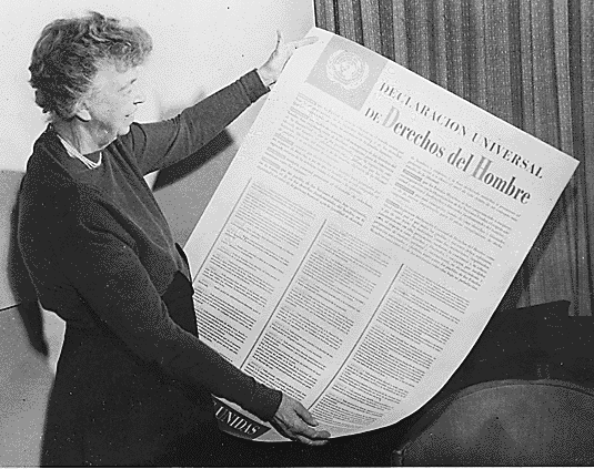 First Lady, Eleanor Roosevelt holding up the Universal Declaration of Human Rights.
