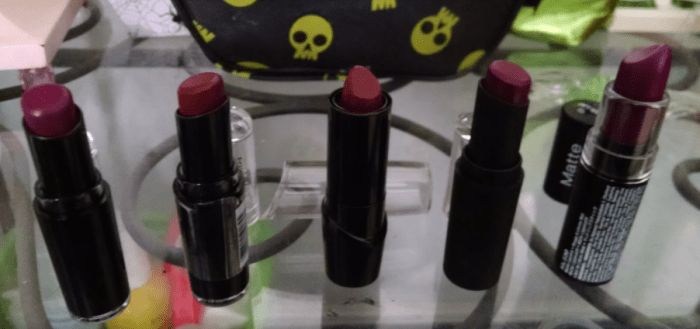 left to right: Wet n' Wild Sugar Plum Fairy, Wet n' Wild Cherry Bomb, Wet n' Wild Black Orchid, Wet n' Wild Vintage Vibe, NYX Aria