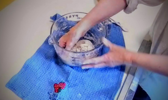 Beginning kneading. An experienced kneader can easily knead this dough right in the bowl, using mostly their knuckles...but if you wish, you may take it out and work it as shown in the video.