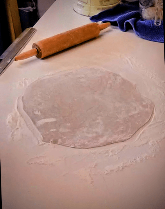 ...to round. This crust is ready to transfer. If you are using a cookie sheet, making two smaller crusts, set side-by-side, can be easier.