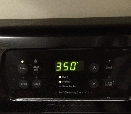 Don't put your cake in before the ding, or beep, or pop, or whatever your oven does to tell you it's hot enough.