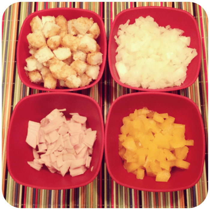 clockwise from top left: frozen tater tots, fresh yellow onion, fresh yellow bell pepper, sliced sandwich turkey,