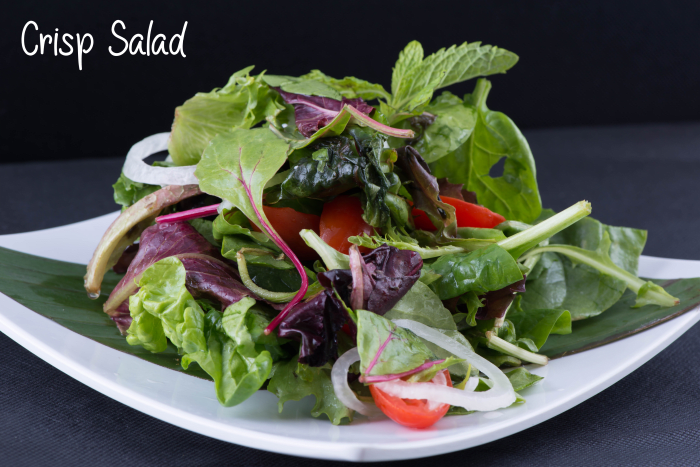 A crisp salad should be able to stand high on a plate like this photo and not be sunk down in a watery mess in a salad bowl. Which would you rather serve to your guests?