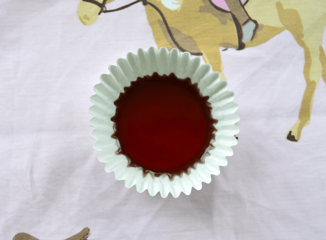 Pour one layer of the liquid jello in at a time. Since I was using five layers of color, I filled in one fifth of the container.