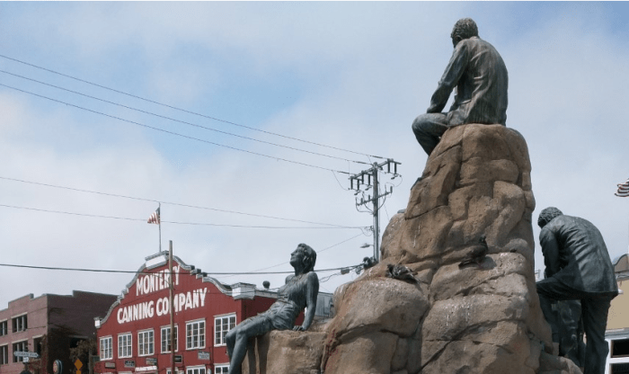 Author John Steinbeck, his bronze hair just lightly streaked with Pigeon (probably not Guillemot) poop, sits in profile, contemplating the birdwatching haven of Monterey's Cannery Row.