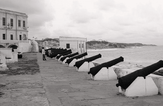 Elmina Castle, in present-day Ghana (formerly the Gold Coast) was the first slave trading post built on the Gulf of Guinea. This is where the slaves are traded and incarcerated before being exported to America, the Caribbean Islands, and Europe.