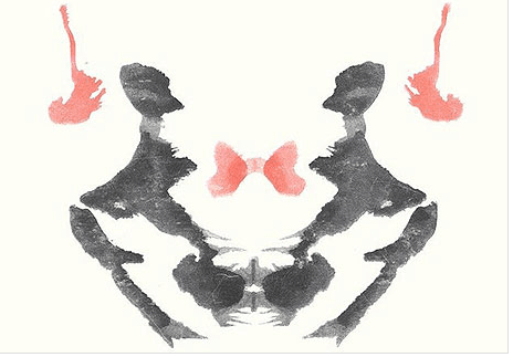 Rorschach Test - I see an alien with big black eyes, its arms held aloft and antlers protruding from its head... yes, seriously.