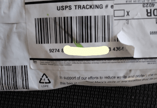 Another Surepost barcode stripped away by the crushing grip of Big Brown Gremlin sticker glue.