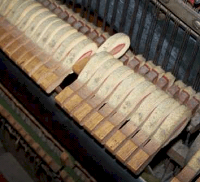Hammers strike the strings and then fall back, giving control and versatility to how the piano is played