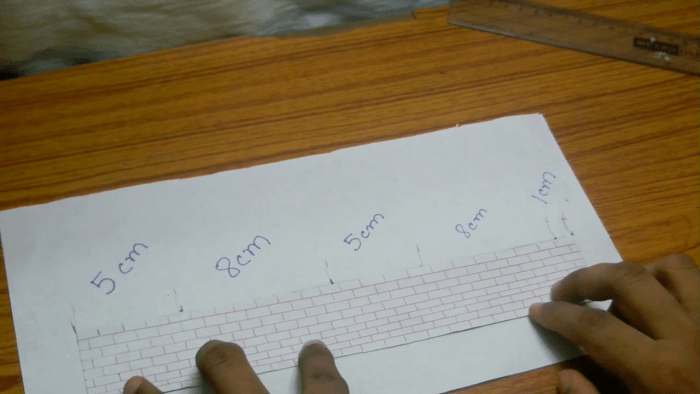 In order to make the walls for the house you need to bend the paper at certain measurements. Mark the paper with pencil from one of its side at 5cm & 8 cm points alternatively and keep a gap of 1cm at the end (as shown in the picture).